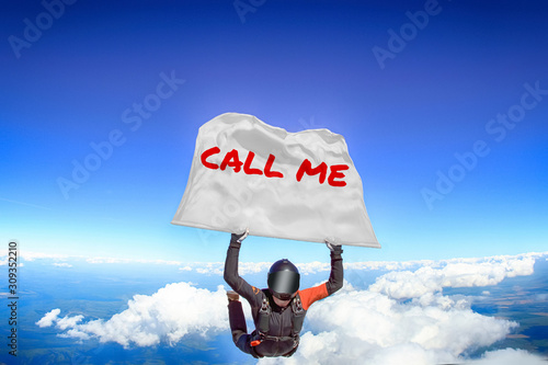 Call me. Flag in skydiving. People in free fall.Teampleat skydiver. Extreme sport.