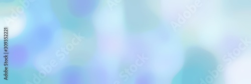 blurred bokeh horizontal background with light blue, sky blue and lavender colors and space for text