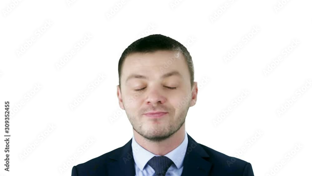 Young businessman in suit makes funny faces -grins, grimaces, sticks his tongue out, crosses his eyes, winks on white background. Young businessman in suit makes funny faces -grins, grimaces, sticks his tongue out, crosses his eyes, winks on white background.