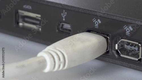 Plugging a IEEE 1394 FireWire 6 Pin Cable into a Hard Drive Enclosure