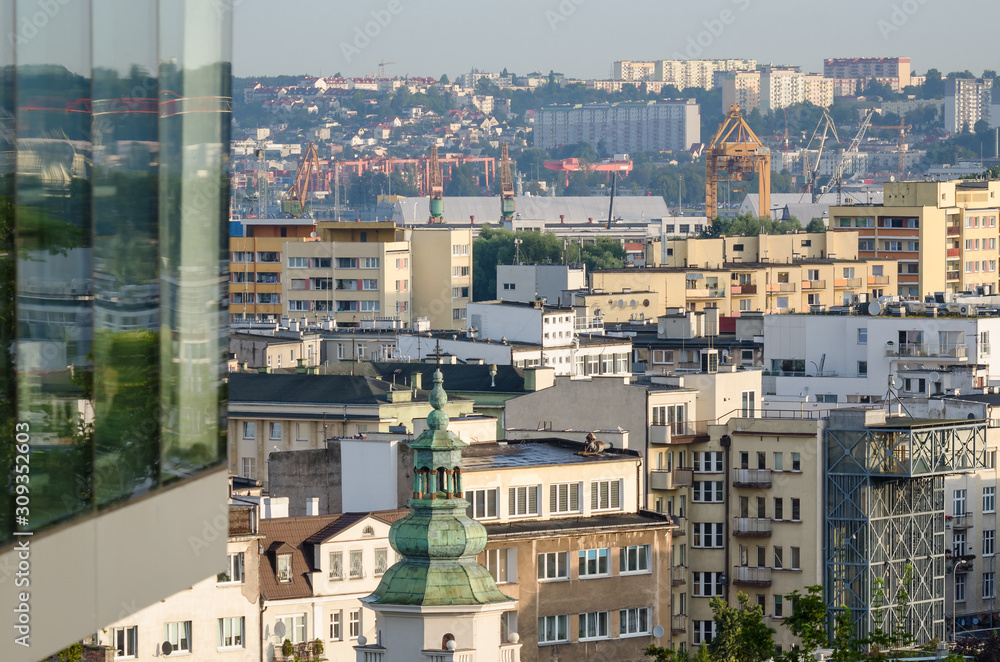 Fototapeta premium BIG CITY LANDSCAPE - Church tower and residential houses in in the morning