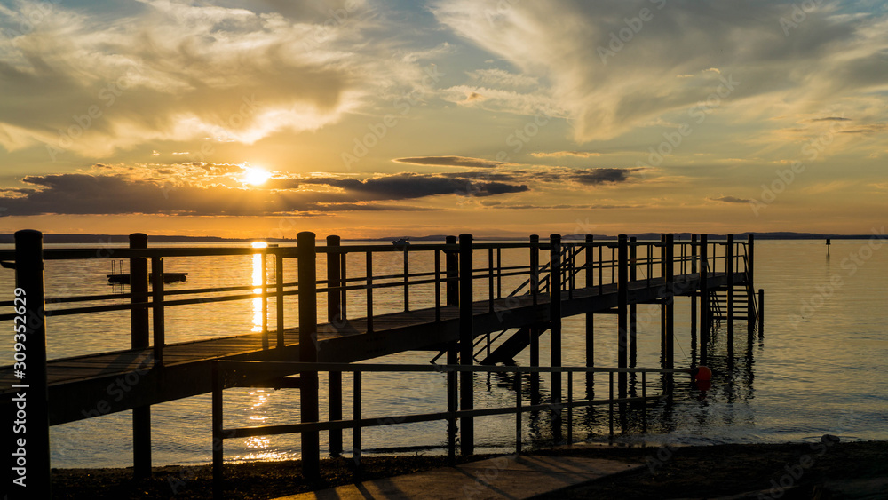 Fototapeta premium old wooden pier at sunset