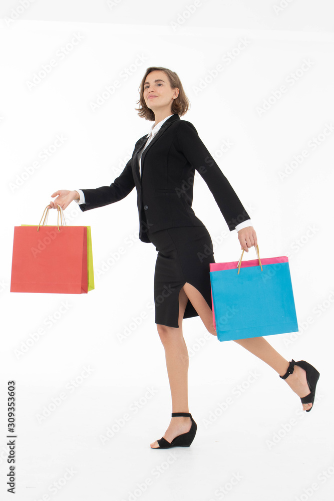 Portrait of young business woman holding shopping bags on white isolated background. Portrait of young business woman holding shopping bags on white isolated background.
