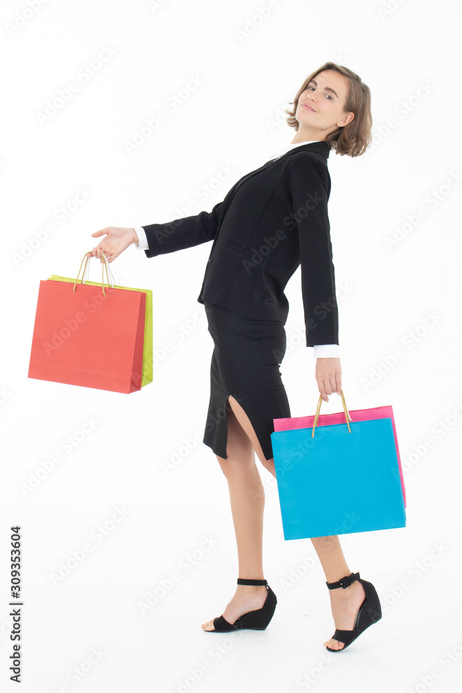 Portrait of young business woman holding shopping bags on white isolated background. Portrait of young business woman holding shopping bags on white isolated background.