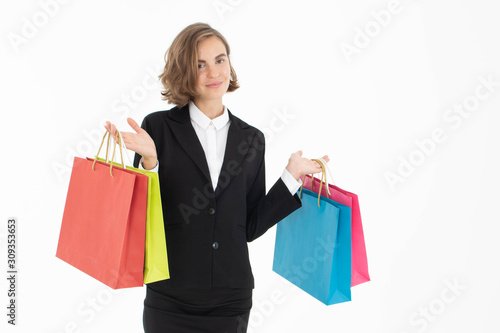 Portrait of young business woman holding shopping bags on white isolated background.