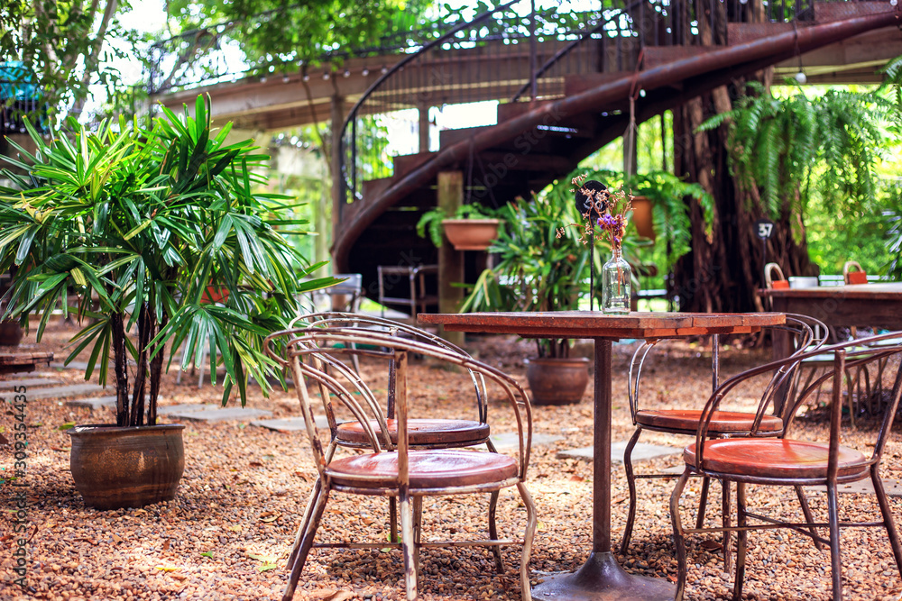 Table and chair are outdoor in the coffee shop. Table and chair are outdoor in the coffee shop.
