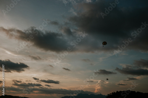 Paragliding on the beach in the sunset in Malaysia
