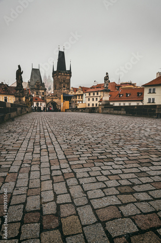 Famous Charles Bridge in Prague, early morning without tourists