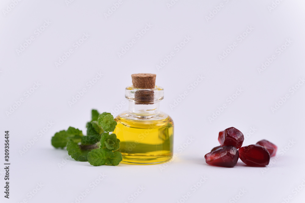mint oil mixed with pomegranate oil in a small bottle mint oil mixed with pomegranate oil in a small bottle
