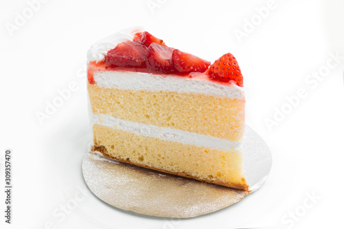 a piece of cake with strawberry on top