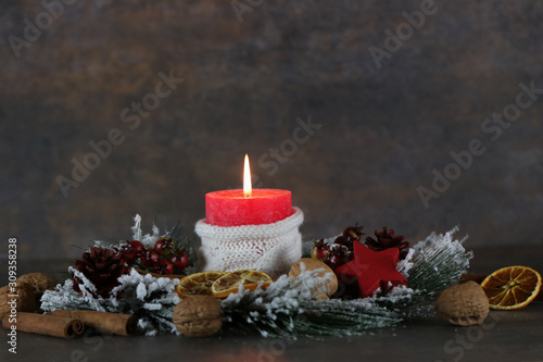Advent decoration with red candle and Christmas decorations