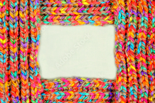 pattern fabric wool Background. relax autumn and winter season arrangement flat lay style with copy space. knitting wool scarf from multi-colored woolen threads. multicolored woolen soft texture. 