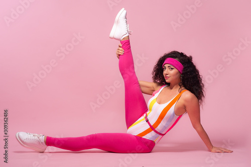 Fototapeta Naklejka Na Ścianę i Meble -  Color background with sport girl, 80s, aerobic