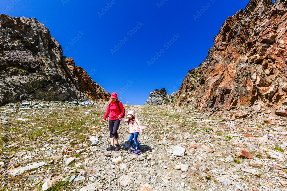 Fototapeta premium Family trekking, mother and daughter camping
