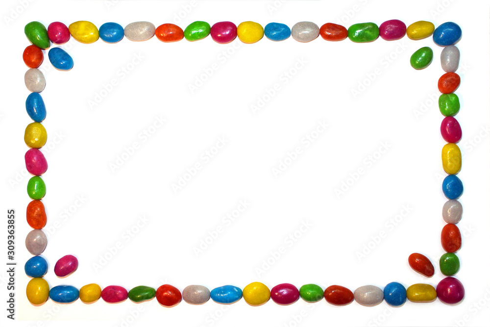 Frame of multicolor candies isolated on white background with space for text Frame of multicolor candies isolated on white background with space for text