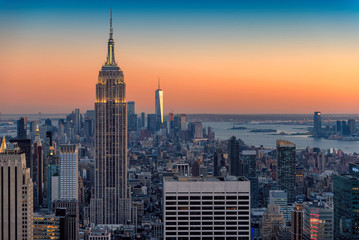 Wandcirkels Empire State Building New York skyline tijdens vurige zonsondergang  © lucky-photo