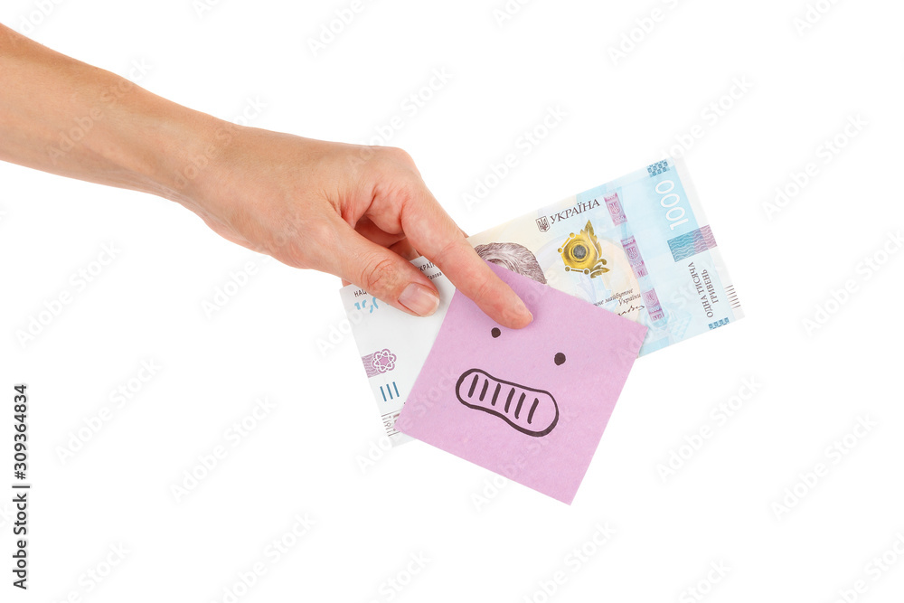Thousand hryvnias and sticker with emoji, in the hand, isolated Thousand hryvnias and sticker with emoji, in the hand, isolated