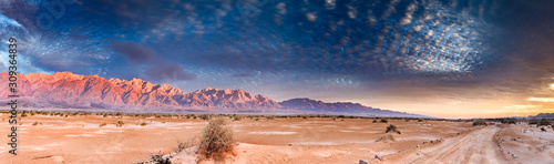 Panorama with colorful sunset in desert area of nature reserve and ecological...