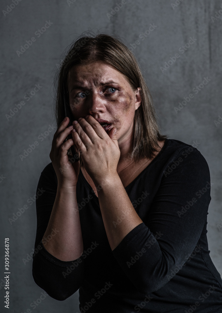 Woman victim of domestic violence and abuse asks for help by phone Woman victim of domestic violence and abuse asks for help by phone