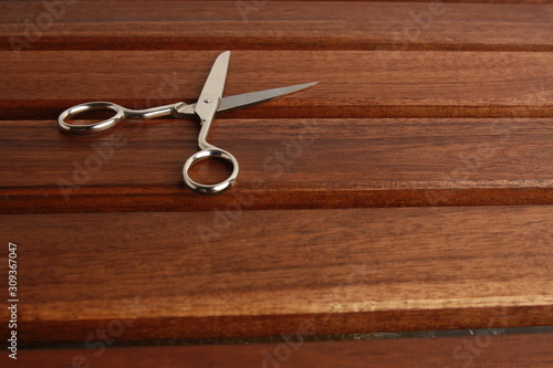 sewing scissors on wooden background