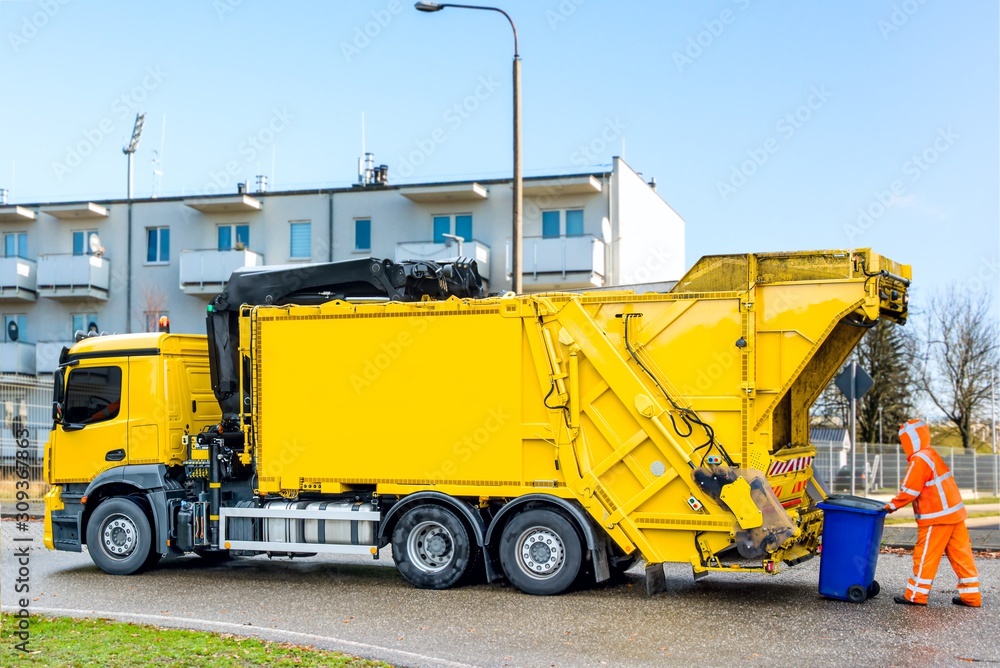 Urban recycling waste and garbage services . the garbage truck works . 