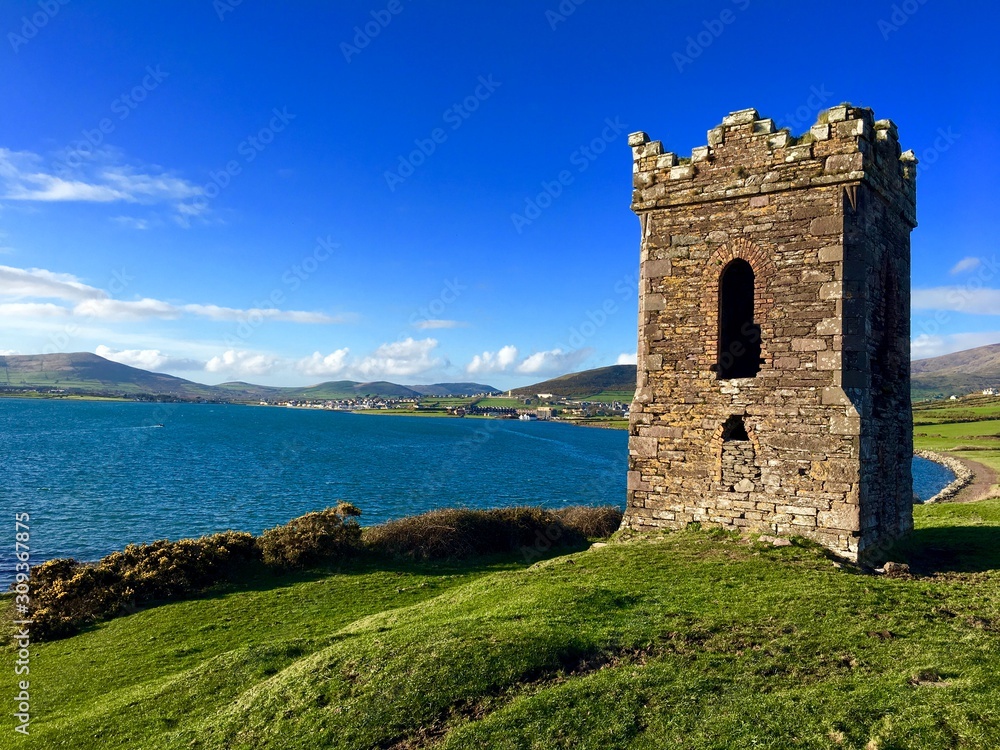 Old stony lighthouse by the sea