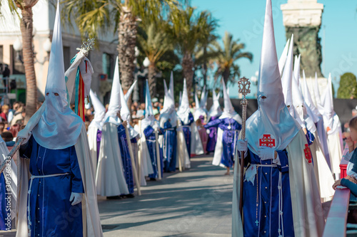 procesiones de semana santa en las calles de Cádiz penitentes del nazareno del amor photo