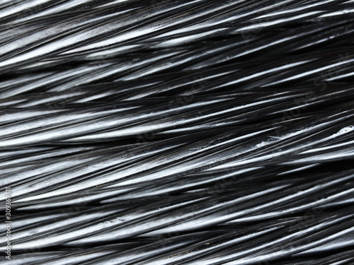 Close up of coiled metal cable industrial background