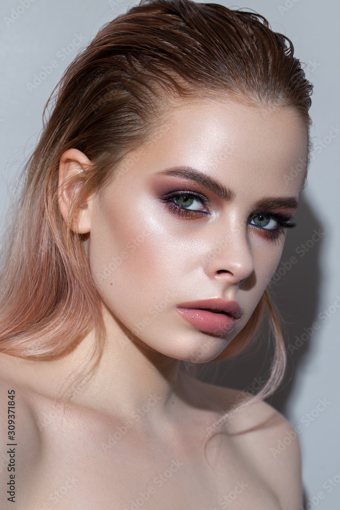 Beautiful young model with professional make up, perfect skin. Trendy purple smokey eyes Beautiful young model with professional make up, perfect skin. Trendy purple smokey eyes