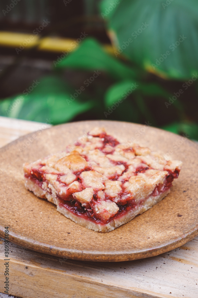 Homemade raspberry crumble bar on plate Homemade raspberry crumble bar on plate