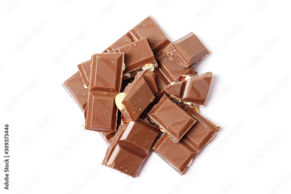 A bar and pieces of milk chocolate isolated on a white background. top view A bar and pieces of milk chocolate isolated on a white background. top view