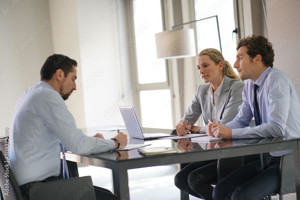 Business people negotiating commercial contract Business people negotiating commercial contract