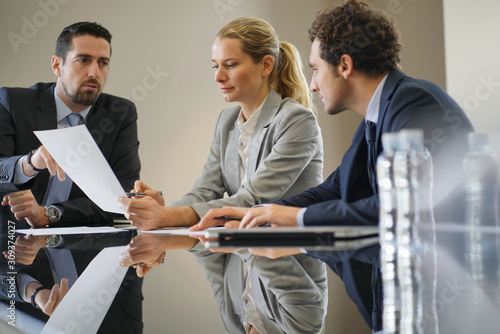 Business people negotiating commercial contract photo