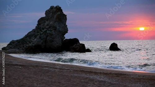 Sunset at Mediterranean sea. Orange cloudy sky at sundown. Mediterranean sea at nightfall. Beautiful ocean at orange dusk. Orange sunset at sea. Incredible sunset with orange clouds in the sky.