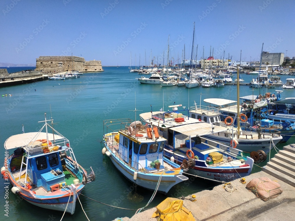 HERAKLION, GREECE - JUNE 27, 2019: casual view on the city streets with pedestrian and visitor at summer sun
