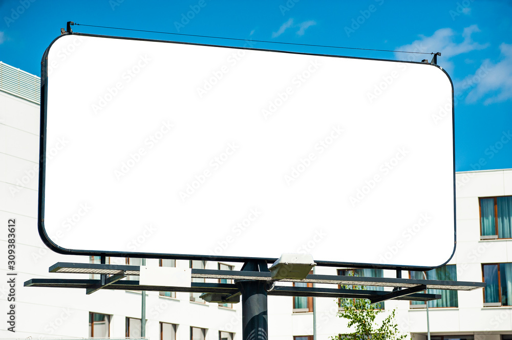 Blank white billboard for advertisement in the fron of modern building Blank white billboard for advertisement in the fron of modern building