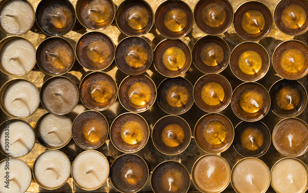 Just prepared butter lamps for fire donations waiting when the oil used in them stiffen. Background image. Just prepared butter lamps for fire donations waiting when the oil used in them stiffen. Background image.
