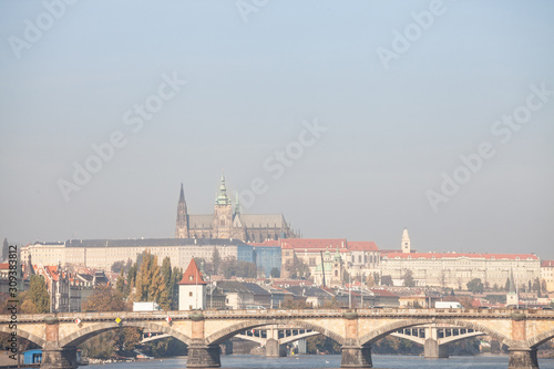 Panorama of the Old Town of Prague, Czech Republic, with a focus on Palackevo Most bridge and the Prague Castle (Hrad Praha) seen from the Vltava river. The castle is the main touristic landmark