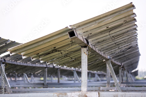 Detail view of the back of a solar photovoltaic panel built with an iron bracket