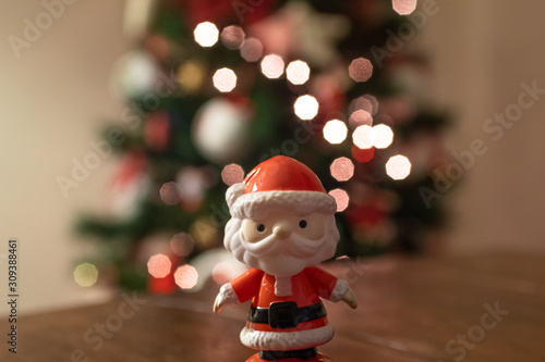 Baby Santa Claus with light-bokeh in the background photo