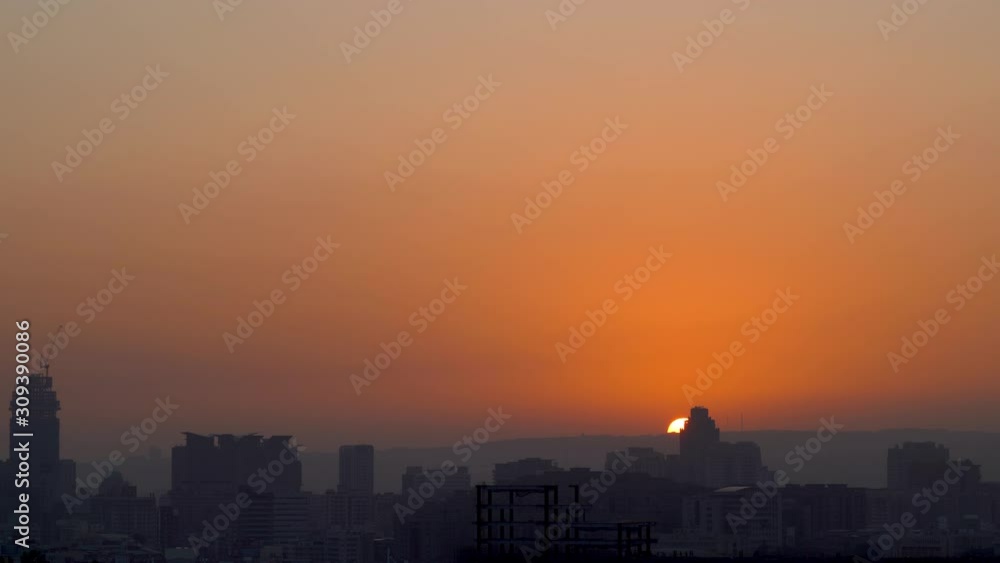 Modern city skyline in sunset time with colourful sky background Modern city skyline in sunset time with colourful sky background