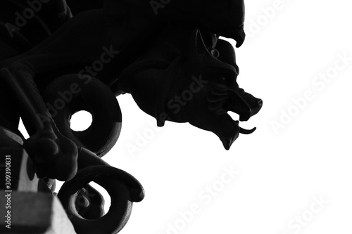 Fototapeta Black and wite silhouette of gargoyle isolated on a wite background