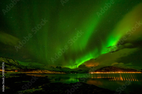 Dramatic aurora borealis  polar lights  over mountains in the North of Europe - Lofoten islands  Norway