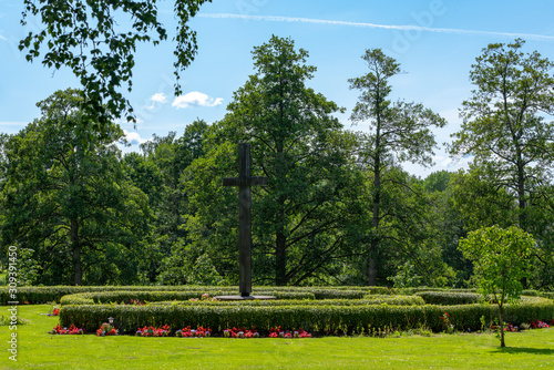 Beautiful cemetery with a maze of graves with colorful flowers