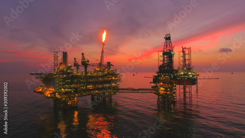 Oil Rig at late evening (offshore) areal photography during sunset.