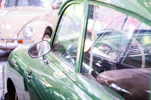 control wheel inside green classic car
