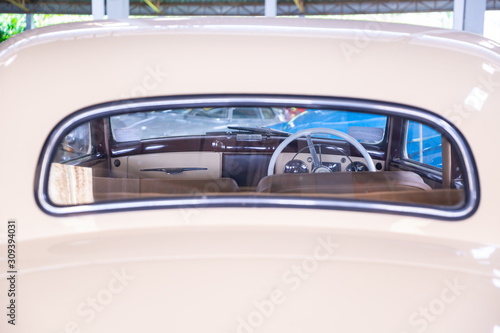 frame of control wheel inside a vintage car . © Rattanachai