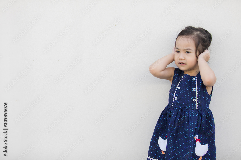 A cute asian girl with a bright blue dress, contrasting with the skin color and white background that everyone will fall in love. A cute asian girl with a bright blue dress, contrasting with the skin color and white background that everyone will fall in love.