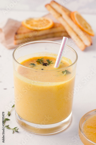 Lassi is a traditional Indian milk mango drink on a white background.