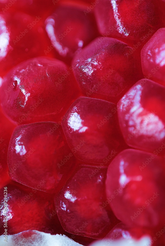 Delicious juicy pink pomegranate close up view Delicious juicy pink pomegranate close up view